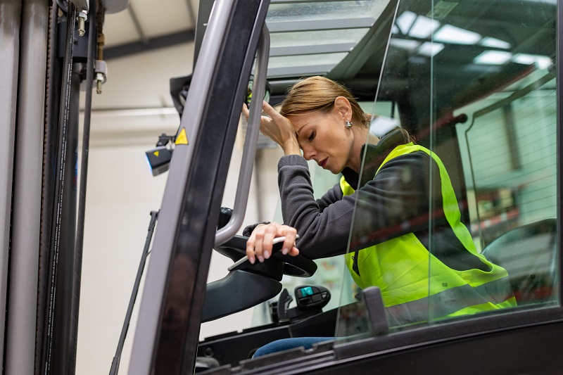 Female warehouse worker driving forklift. Warehouse worker preparing products for shipmennt, delivery, checking stock in warehouse. Female warehouse worker driving forklift. Warehouse worker preparing products for shipmennt, delivery, checking stock in warehouse.