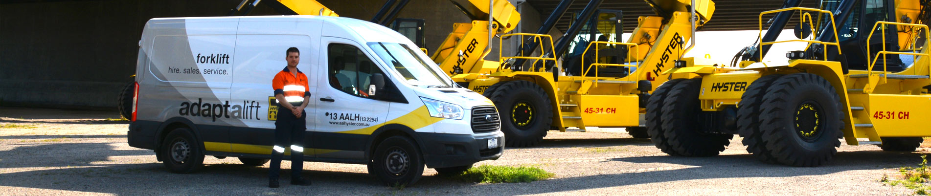 Adaptalift technician with service van and trucks